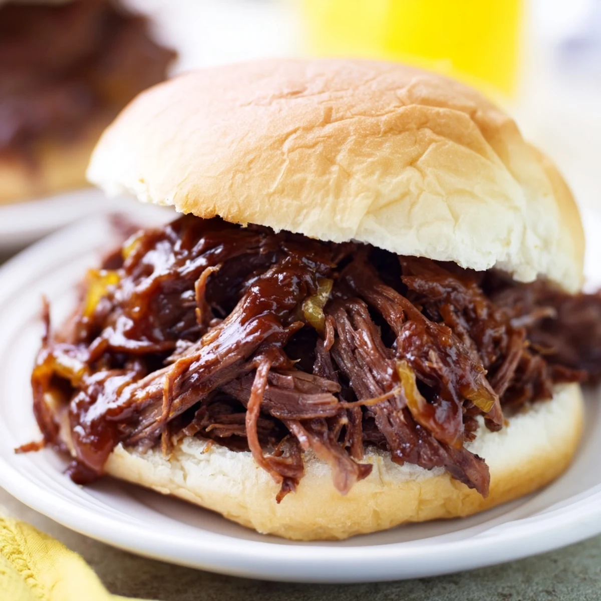 Delicious Slow Cooker Pulled Beef Sandwiches offer a perfect blend of smoky flavors with every bite.