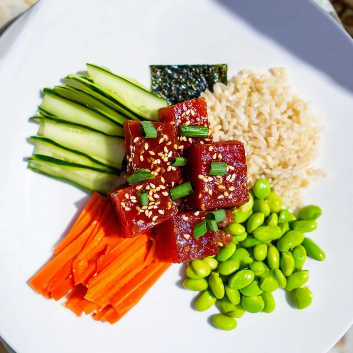 Vibrant Spicy Tuna Poke Bowl, featuring glistening tuna and creamy avocado atop fluffy rice.