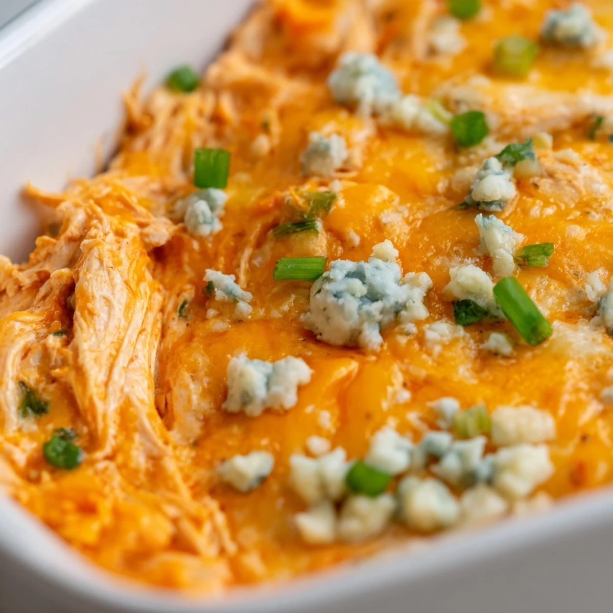 Hot sauce and cheddar cheese make this creamy, shredded chicken dip perfect for game day.