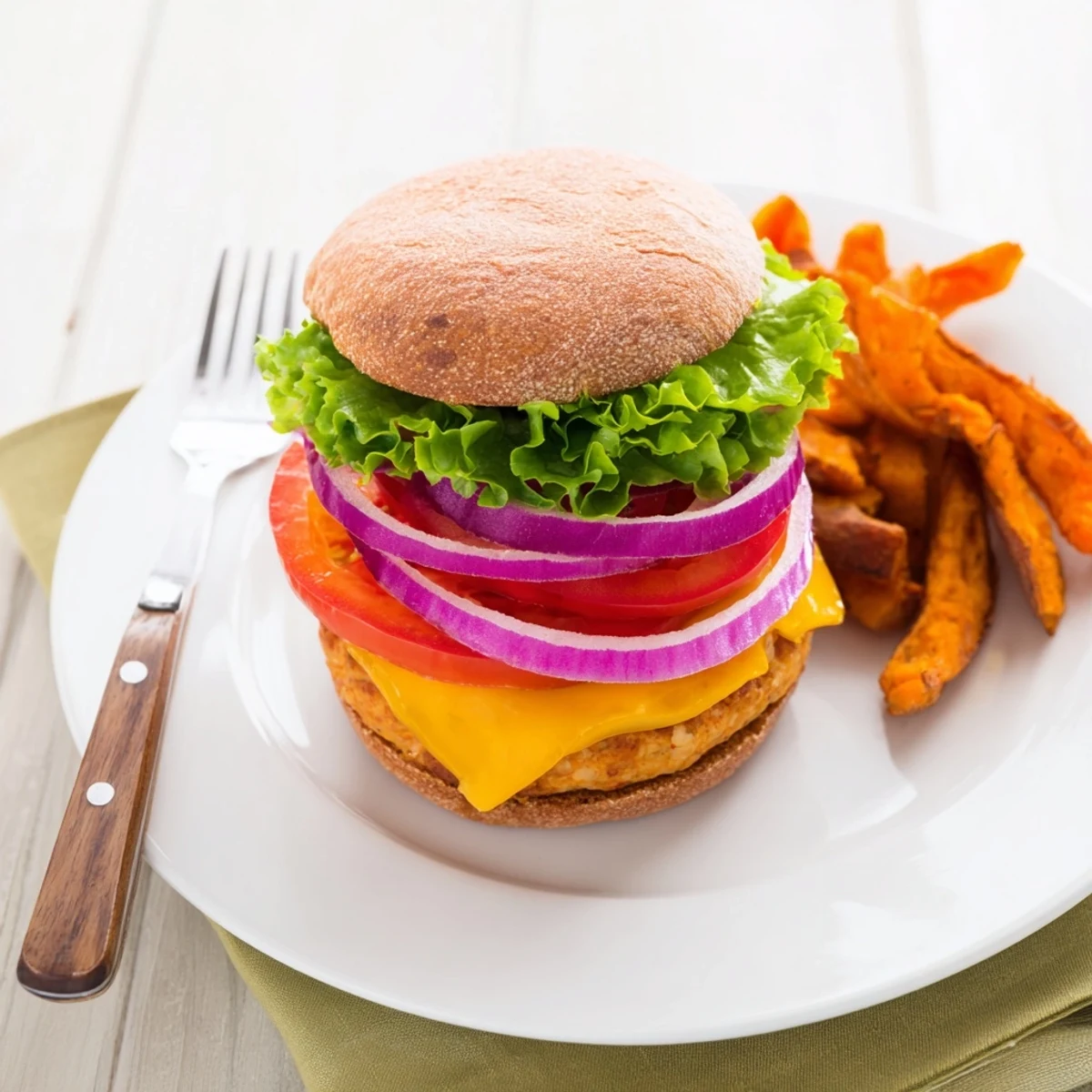 Perfectly cooked turkey patties and oven-baked sweet potato fries make an easy, healthy weeknight dinner.  