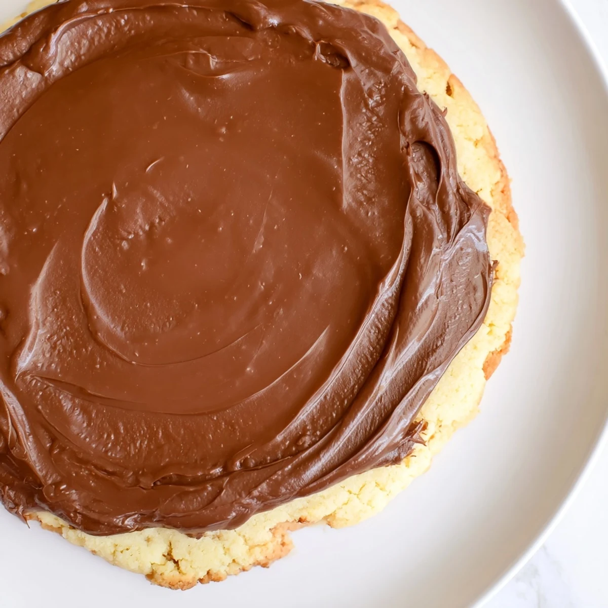 Close-up of freshly made Twix Cookies showing crunchy shortbread, rich caramel center, and a shiny chocolate shell perfect for gifting.
