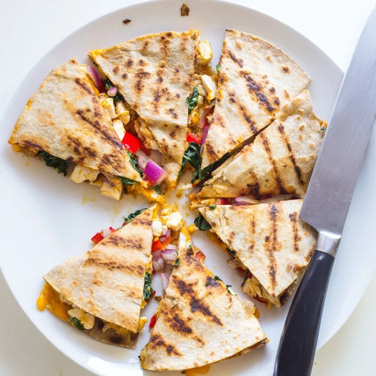 Whole wheat tortilla packed with seasoned chicken, spinach, bell peppers, and melted cheese