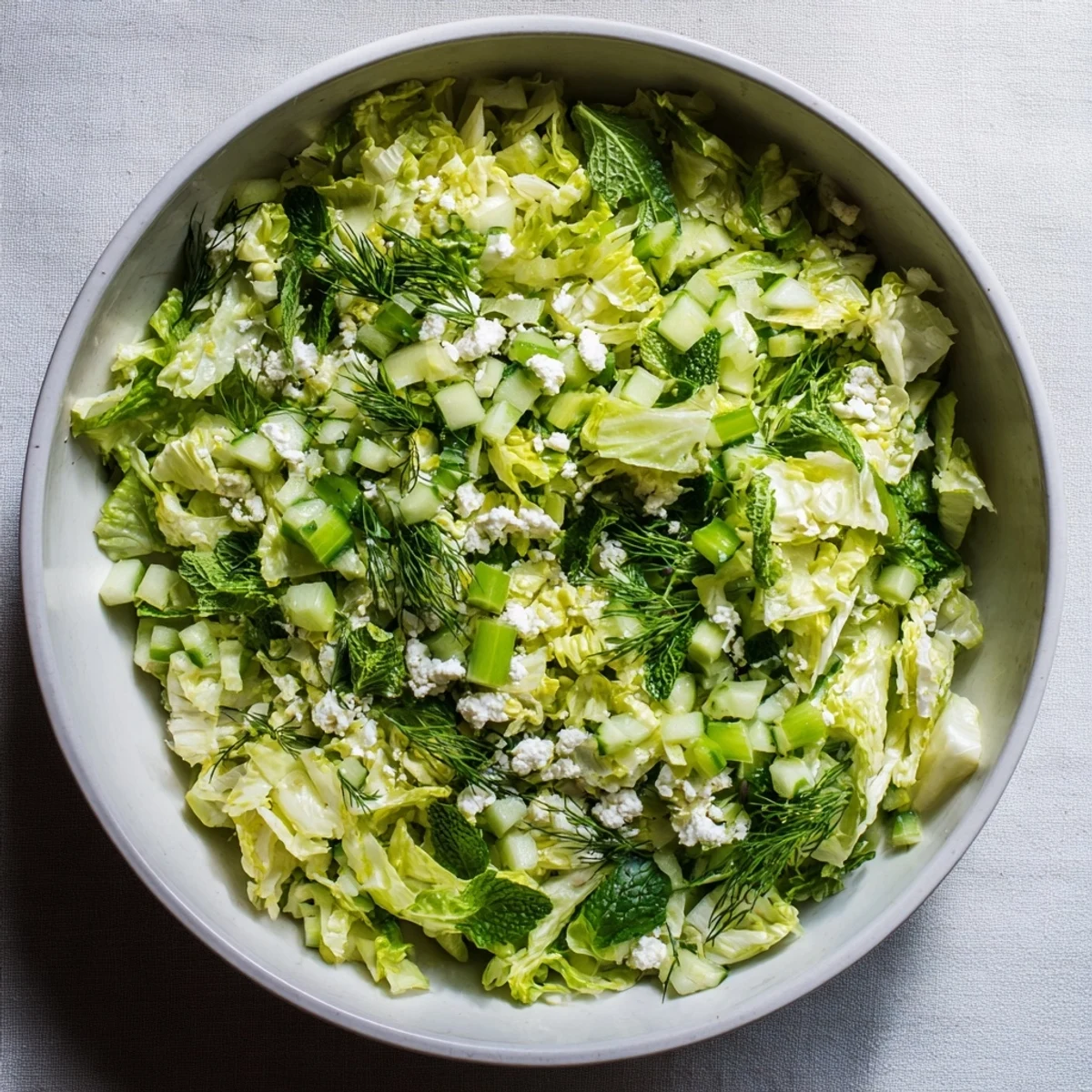 Traditional Greek Maroulosalata salad tossed in bright lemon vinaigrette, garnished with fresh scallions and herbs