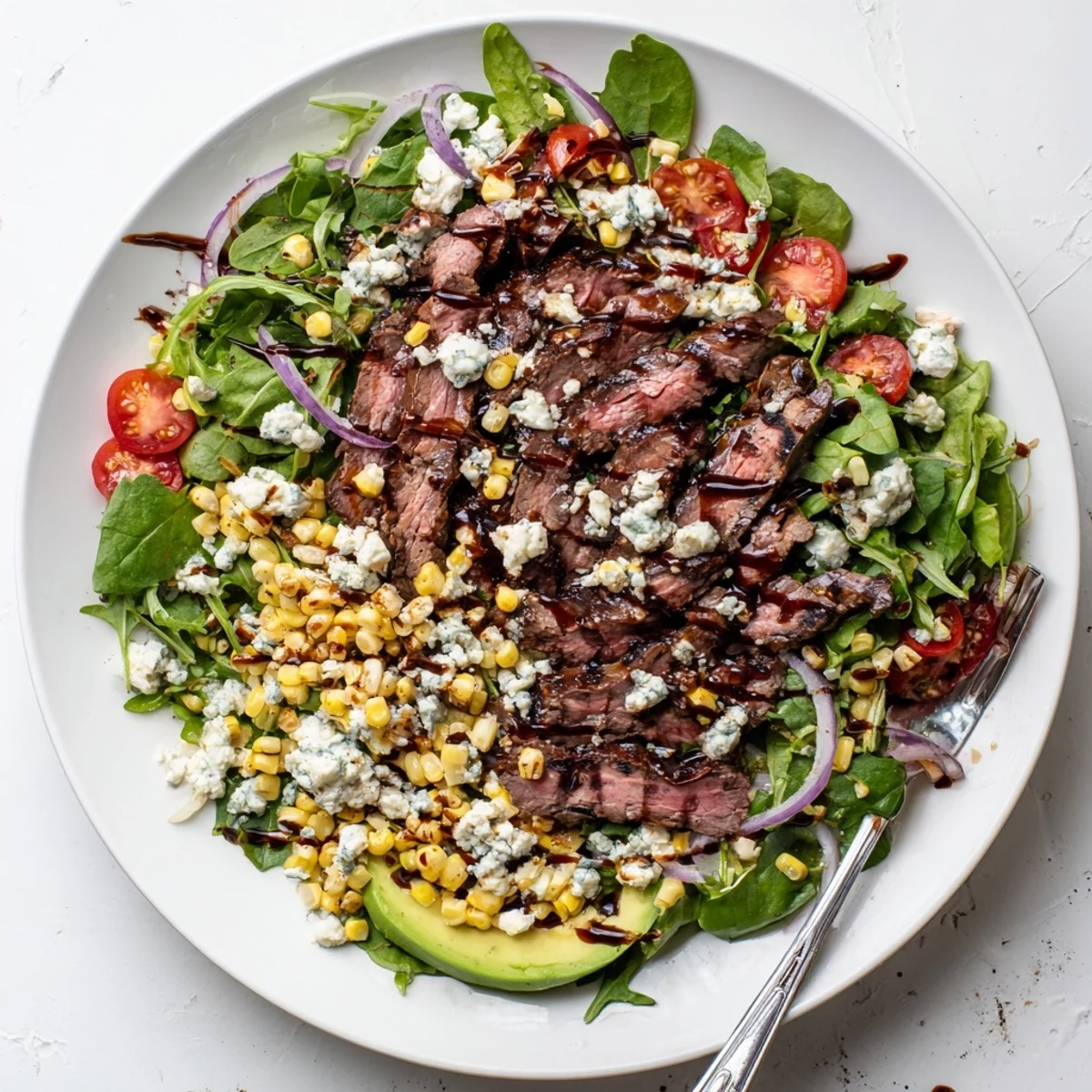 Crisp greens topped with juicy marinated steak crumbled Gorgonzola and sweet grilled corn