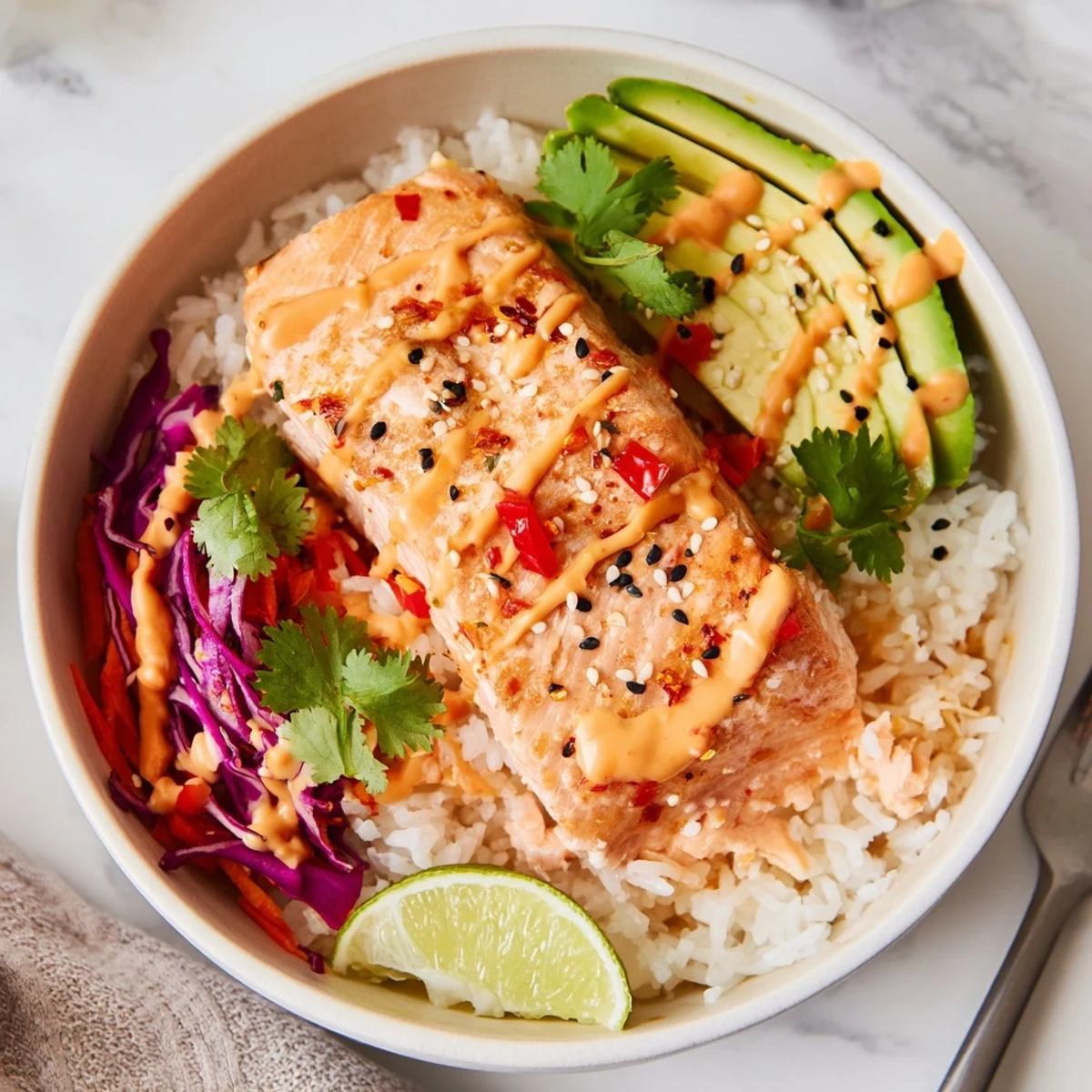 Bang Bang Salmon Bowls Recipe showing roasted salmon atop rice with creamy sauce