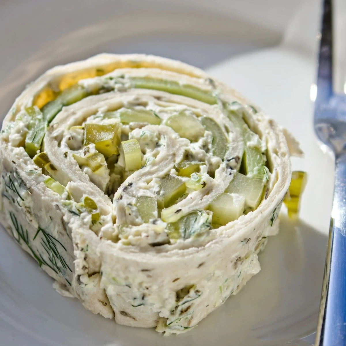 Pickle Dip Pinwheels chilled on a platter, creamy dill tang and crunch