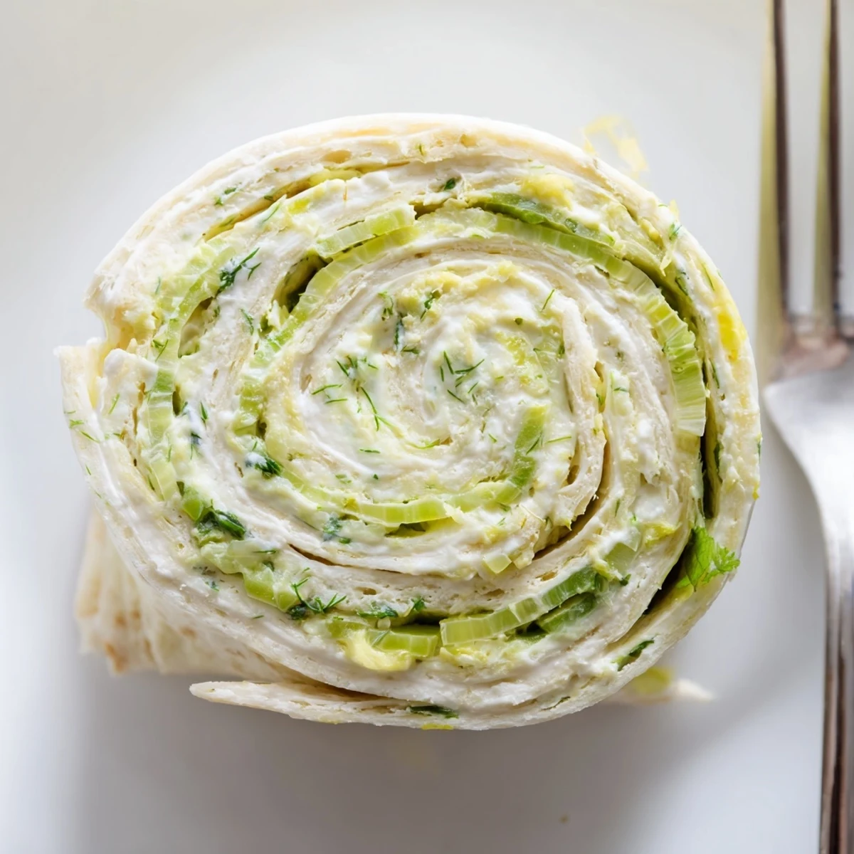 Savory Pickle Dip Pinwheels sliced, soft tortillas, crisp pickle bits visible