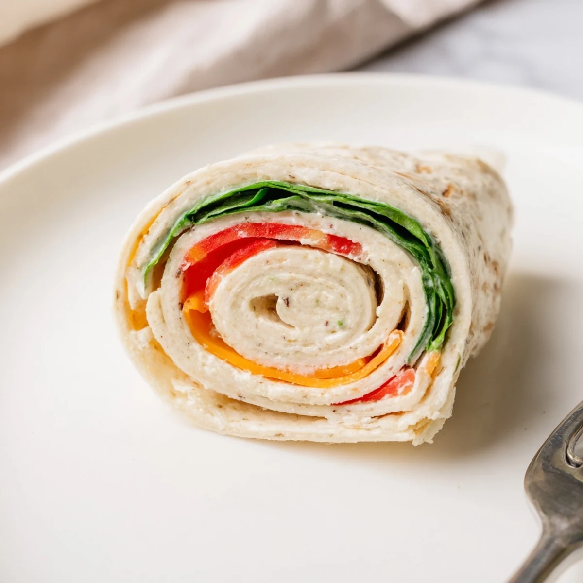 Pinwheel Sandwiches on a platter, colorful layers, creamy filling, perfect for picnics