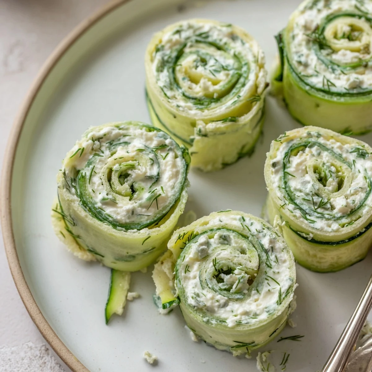 Soft tortilla Cucumber And Dill Pinwheels sliced, creamy herb spread visible, ready to serve