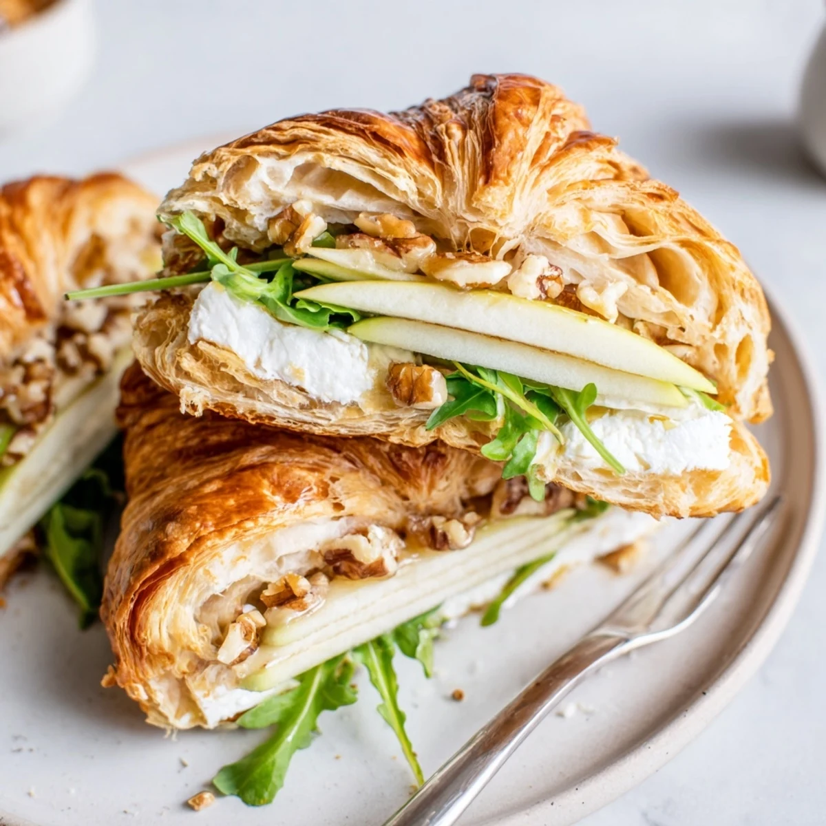 Open-faced Apple Goat Cheese Croissant Sandwich Recipe served with arugula, honey drizzle