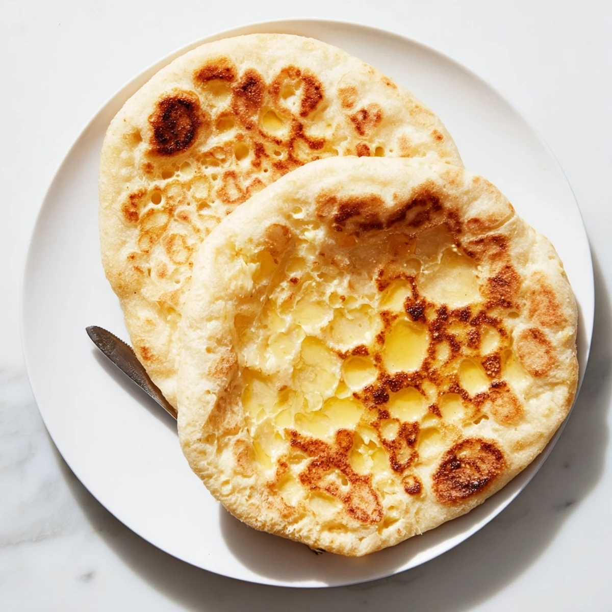 Freshly cooked Turkish Bazlama flatbread with golden bubbles and soft pillowy texture