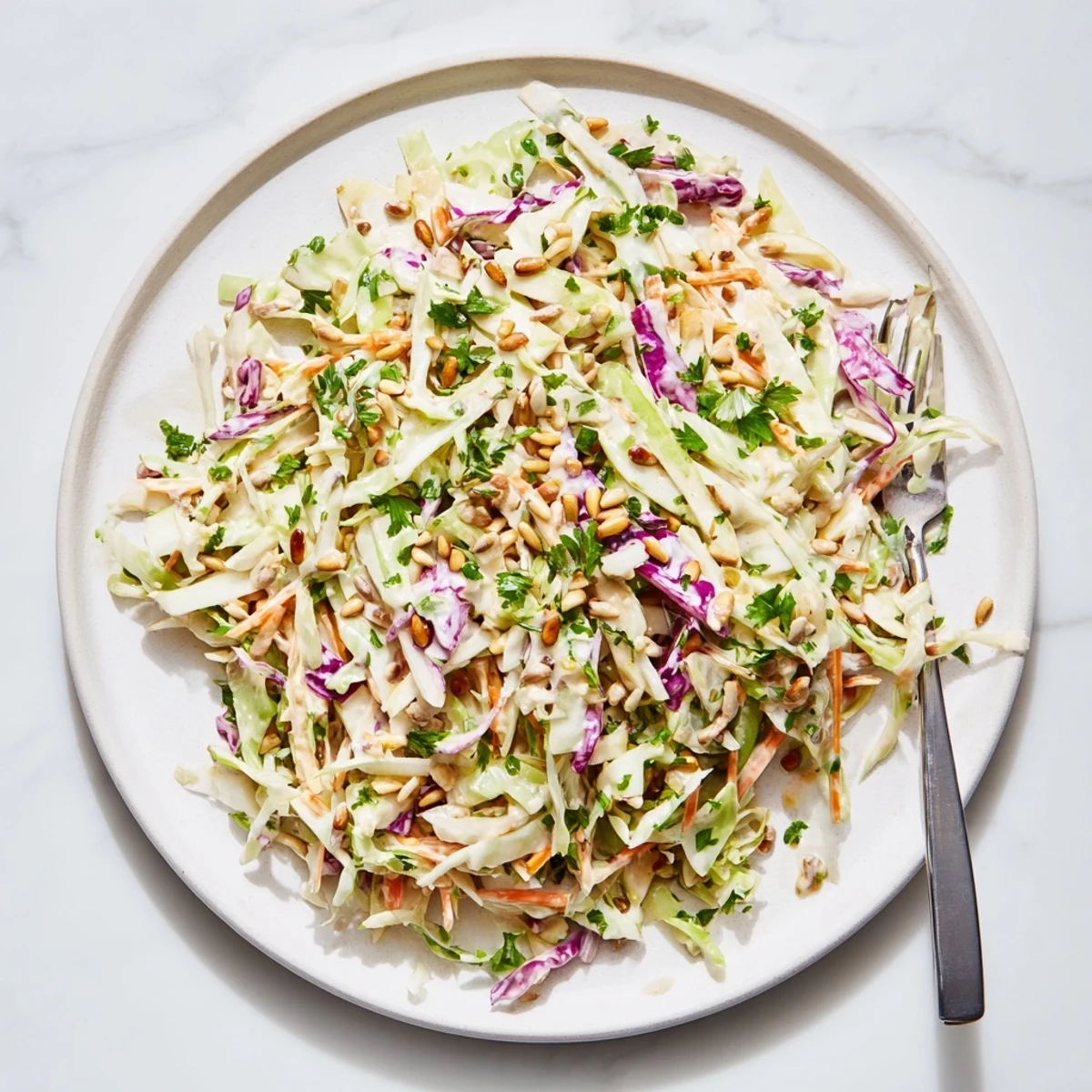 Crisp apple coleslaw with shredded cabbage in creamy dressing, fresh summer side dish