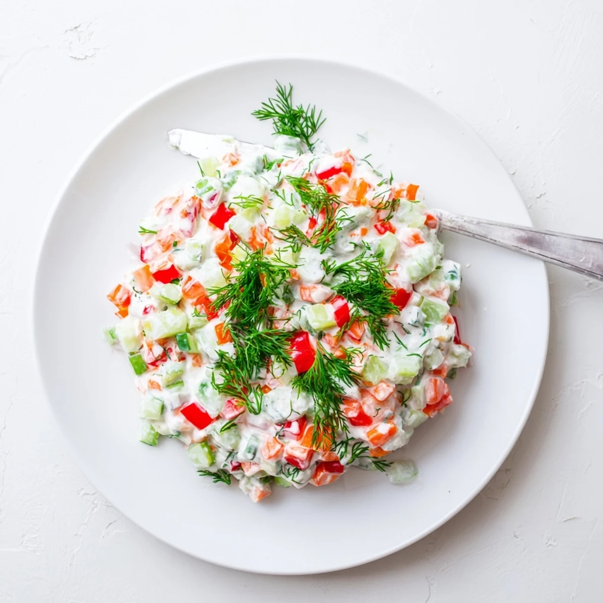 Light and flavorful garden vegetable spread bowl showcasing chopped vegetables blended with soft cream cheese